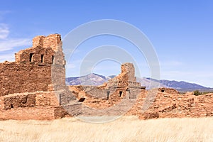Abo Ruins, New Mexico, with Manzano Mountains in the distance. Full sunshine, blue sky