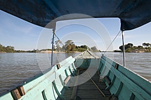 Aboard long boat transport on the mekong river