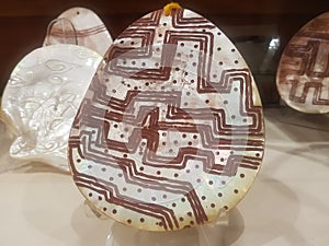 Aboriginal carving on pearl shell photo