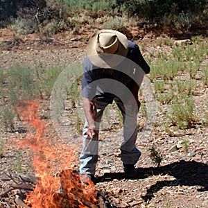 Aboriginal setting a fire