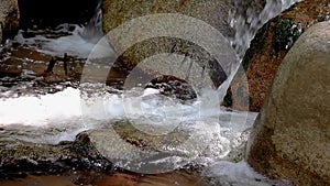 Abounding river detail with close up of rock, in Spanish Pyrenees mountains