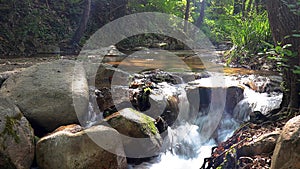 Abounding river detail with close up of rock, in Spanish Pyrenees mountains