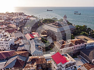 Above the Building Roofs Aerial view of Zanzibar, Stone Town. Tanzania. Sunset Time Coastal City in Africa