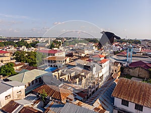 Above the Building Roofs Aerial view of Zanzibar, Stone Town. Tanzania. Sunset Time Coastal City in Africa