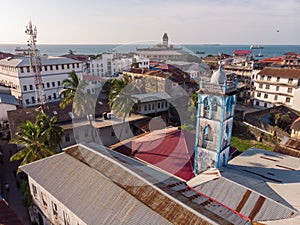Above the Building Roofs Aerial view of Zanzibar, Stone Town. Tanzania. Sunset Time Coastal City in Africa