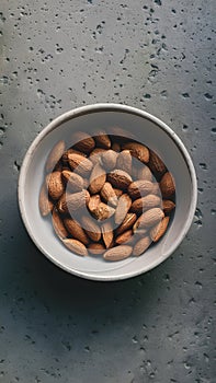 From Above Ceramic Bowl with Organic Almonds on Concrete Surface