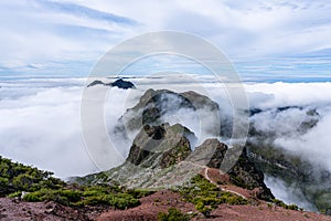 Above the clouds on the mountain peak Pico Ruivo on Madeira Island - Cloud Covered Mountain Landscape