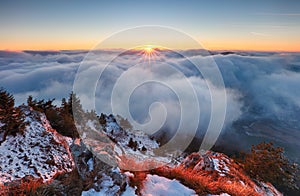 Above clouds in winter - mountain landcape at sunset, Slovakia photo