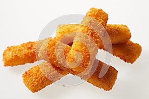 Appetizing bright fish sticks on white background