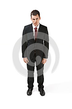 Above front portrait of a businessman with very serious face. Confident professional with piercing look in the