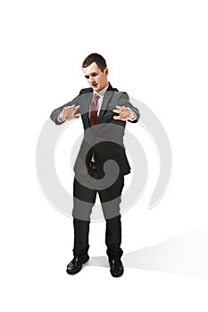 Above front portrait of a businessman with very serious face. Confident professional with piercing look in the