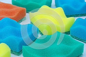 Above is a full frame of many soft multicolored dishwashing sponges. Cleaning, hygiene concept
