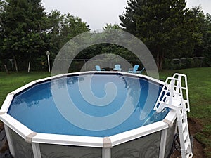 Above ground round swimming pool with ladder