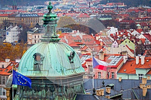 Above medieval Prague old town towers and domes at evening, Czech