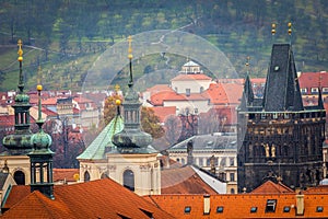 Above medieval Prague old town towers and domes at evening, Czech