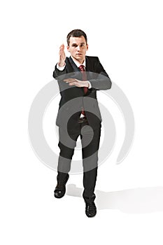 Above portrait of a businessman with very serious face. Confident professional with piercing look in the foreground of