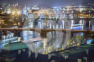 Above Prague old town bridges and river Vltava at night, Czech Republic