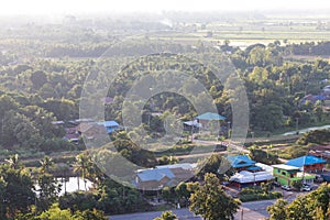 Above the rural village with trees.