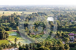 Above the rural village with trees.