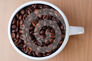 Above Shoot of Large White Cup Full Of Coffee Bean