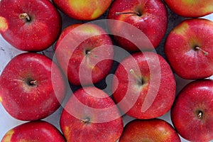 From above shot of tasty red apples flat lay. Gyration red ripe apples close-up. photo