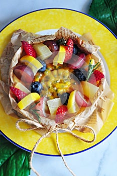 Above of Summer Fruits Cheesecake on Yellow Dish