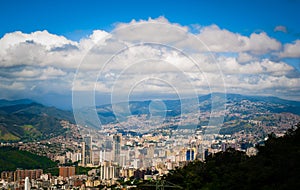 Above view of Caracas city in Venezuela from Avila mountain during sunny cloudy summer day photo