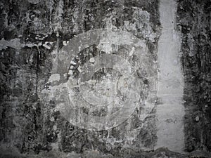 Above view of cement plaster surface has an old black stain.