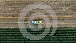 Above view on combine, harvester machine, harvest ripe cereal