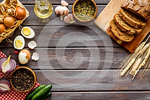 Above view of country dinner table with effs, bread, potatoes