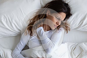 Above view frown woman feels pain in neck