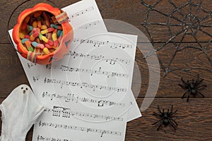 Above view of Happy Halloween Festival and music note sheet background concept.