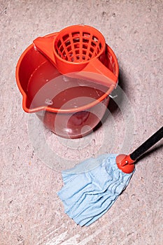 above view of mop cleaning linoleum flooring