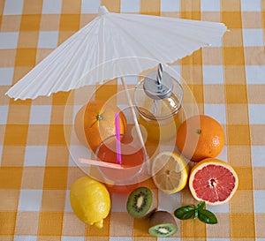 Above view of orange, lemon, grapefruit and kiwi, all fruits rich in vitamins. Citrus fruits and kiwi. Fruit juice. Yellow