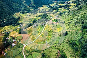 Above view of Tavan village and rice field terraced in valley at