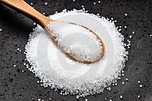 Above view of wood spoon with crystalline fructose