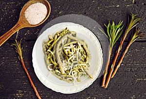 Above view of young fireweed plant boiled and fried with butter and served with grated cheese. Willowherb or known as Chamaenerion