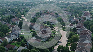 Above wide aerial view. Residential houses in suburbs near city .