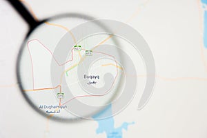 Abqaiq city in Saudi Arabia visualization illustrative concept on display screen through magnifying glass photo