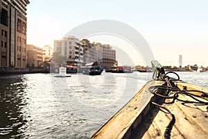 Abra boat in Dubai Creek. Water taxi in river. Passenger city view from traditional ferry. Cruising and old transportation in UAE.