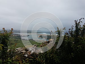 Abra del Pas Golf Club next to estuary of Mogro, Pas river mouth to Liencres beach from La Picota mountain. Natural park of Dunes photo