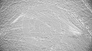 Abrade on grey cement wall texture.