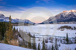 Abraham lake covered with snow in golden hour