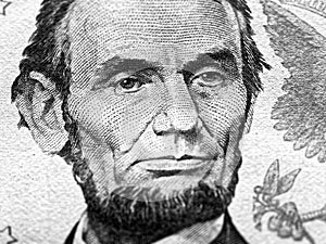 Abraham Lincoln portrait macro on 5 dollars money usa or american banknote