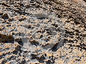 Abrasions on limestone cliffs and surface changes and patterns in stones