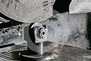 Abrasive grinding stone on a surface grinder with the correct cone installed before cleaning the wheel from sticking and leveling