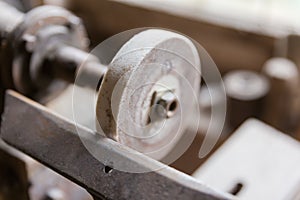 Abrasive wheel of electric sharpener, close-up in selective focus