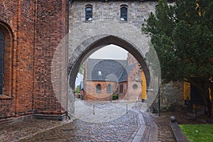 The Absalon Arch between bishop's palace and Gothic Roskilde Cathedral, Denmark