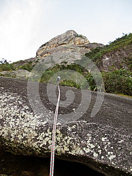 Abseiling from Dedo de deus mountain in Brazil photo