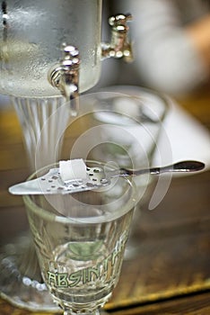 Absinth glass and fountain photo